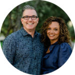 portrait of a man and woman standing side by side and smiling